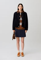 Oversized jacket with gold poppers