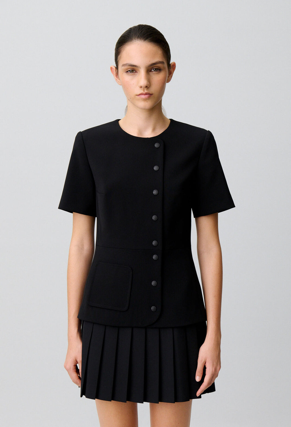 Short pleated peplum dress